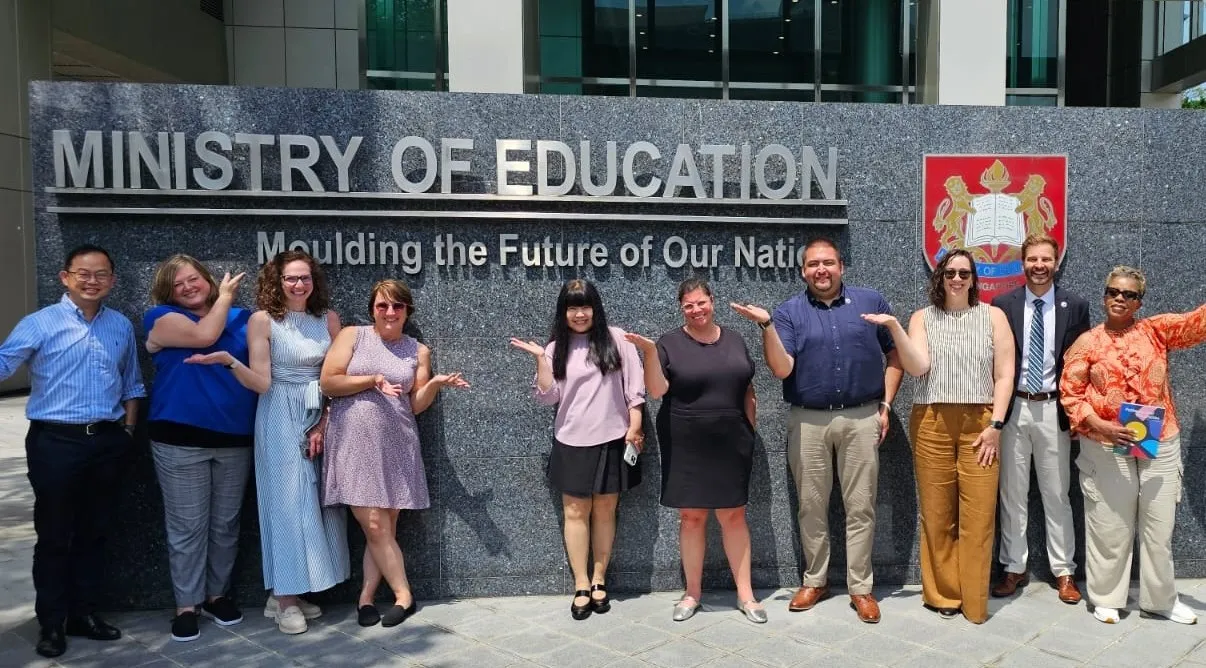 Group of administrators standing outside the Ministry of Education